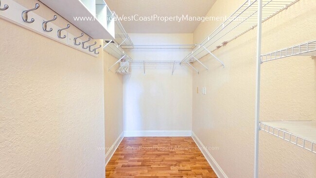 Building Photo - MOVE IN READY! LARGE 2 BEDROOM/2 BATH PLUS ATTACHED GARAGE! TILE/LVP THROUGHOUT!