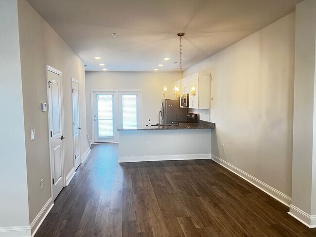 Building Photo - Available Now! - Pet Friendly 2 Bedroom, 2.5 Bath Townhome at Market Common! Cable and Internet I...