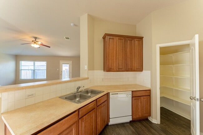 Building Photo - Charming Brick Home with Open Floorplan, Vaulted Ceilings, and Luxurious Amenities—Perfect for An...