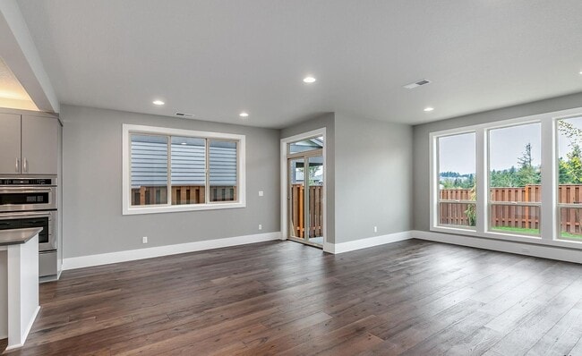 Building Photo - Bethany Stunner - 5 Bedrooms with Main-Level Bed & Bath, Modern Kitchen & Private Fenced Yard