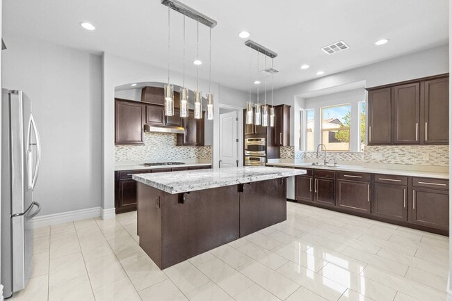 Building Photo - Canyon Falls Single-Story: Chef’s Kitchen, Office + Built-In BBQ Yard (3-Car)