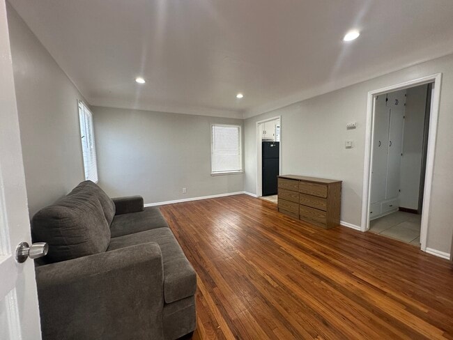 Central living area offers hardwood floors - 5646 Farmdale Ave