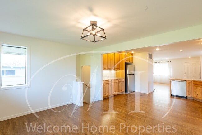 Building Photo - Spacious 5 Bedroom Home with Fenced Yard & Covered Parking