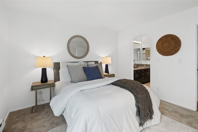 Glimpse into your spacious private bathroom with two sets of doors, ample shelving - 730 Bellevue Ave E