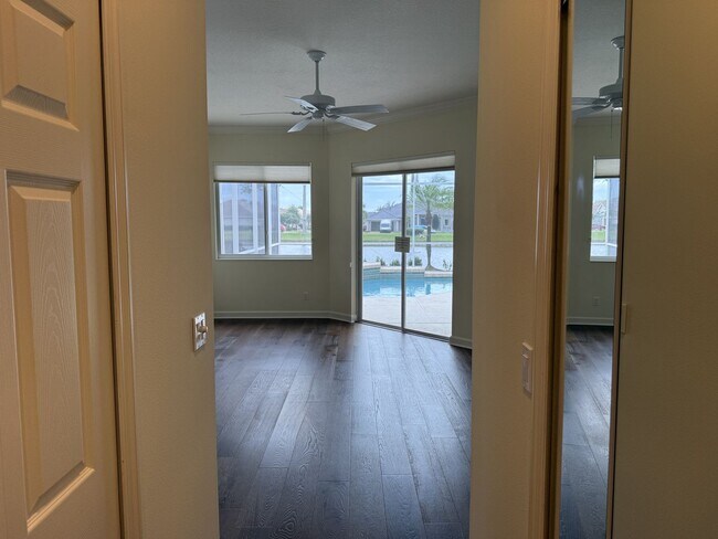 Building Photo - Luxurious 4 Bedroom 3 Bath Lakefront Pool Home W/3-Car Garage