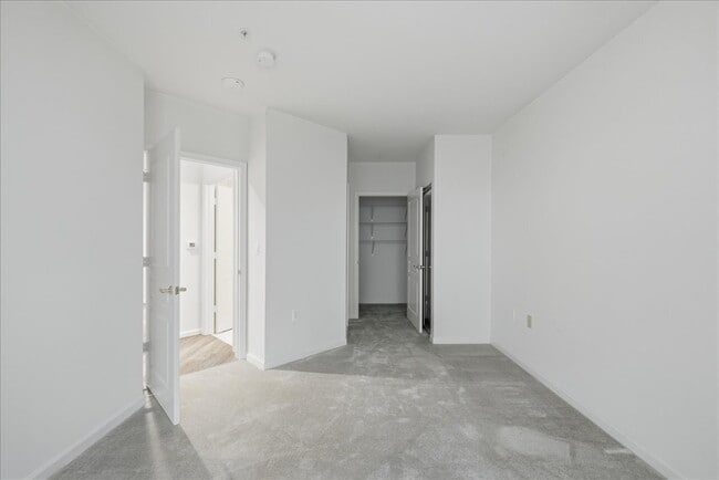 Building Photo - Commuter’s Paradise! Ground-Level 2BR Condo  Welcome home to this stunning, sun-filled 2-bedroom ...