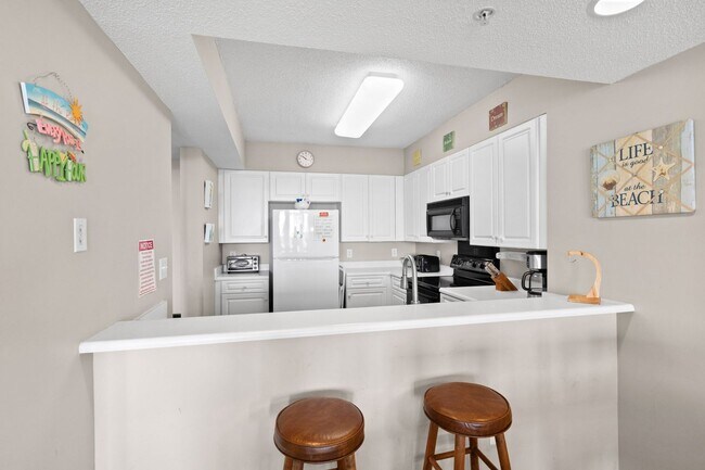Building Photo - Spacious 3BR/3BA Coastal Retreat at Harbour Pointe – Utilities Included!