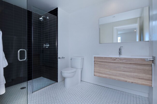 Building Photo - ~ 4 Bedroom 4 Bathroom Washer and Dryer in Unit Gated parking with EV Charging