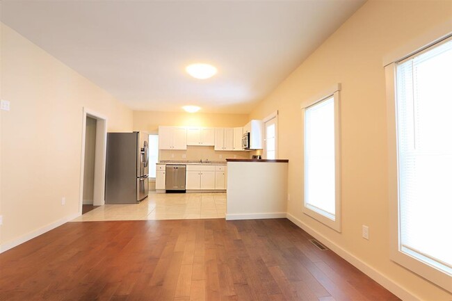 Living room looking into kitchen - 881-1 Concord Ave