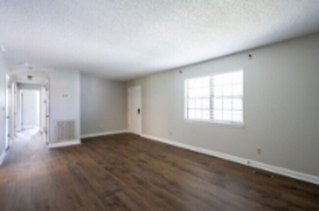 Building Photo - This beautifully updated brick home in Har...