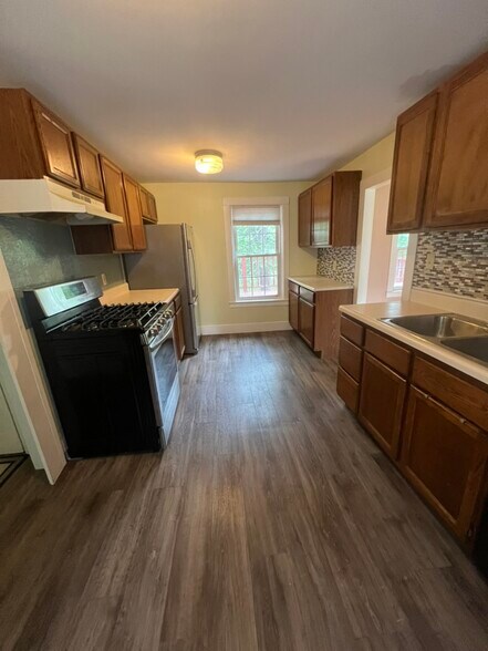 kitchen with back deck access - 104 Main St