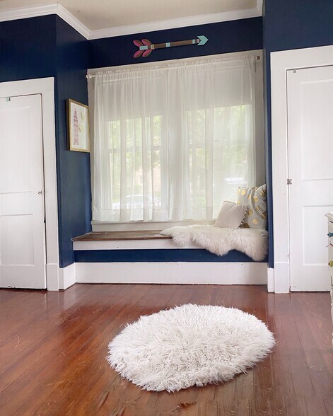2nd bedroom features abundant light, window seat, and double cloets - 1003 Egan St