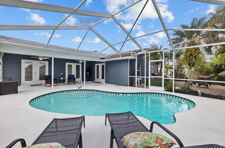 Expansive pool deck perfect for entertaining or relaxing. - 1932 Brainerd Ct