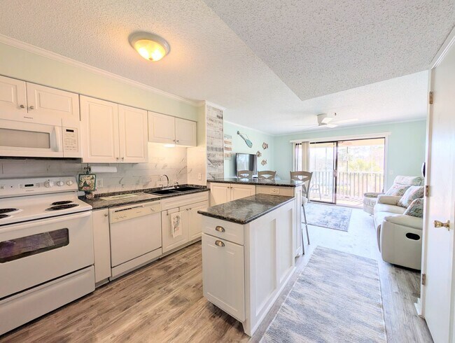 Building Photo - Dreamy Little River Condo — Furnished, Elevator Access, Pool & Marina Nearby!
