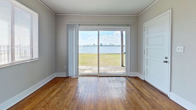 Building Photo - Riverfront Living! First Floor Unit w/ Private Patio, Stunning Views & Upgraded Kitchen