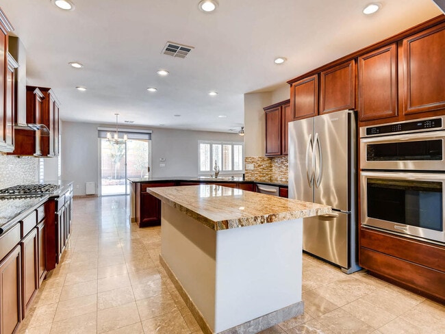 Building Photo - LUXURIOUS UPGRADED HOME IN A GATED SUMMERLIN AREA!!HOUSE HAS POOL AND SPA AND PATIO COVERED BACKY...