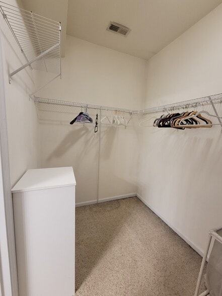 Primary walk-in closet first floor - 204 Silk Oak Dr