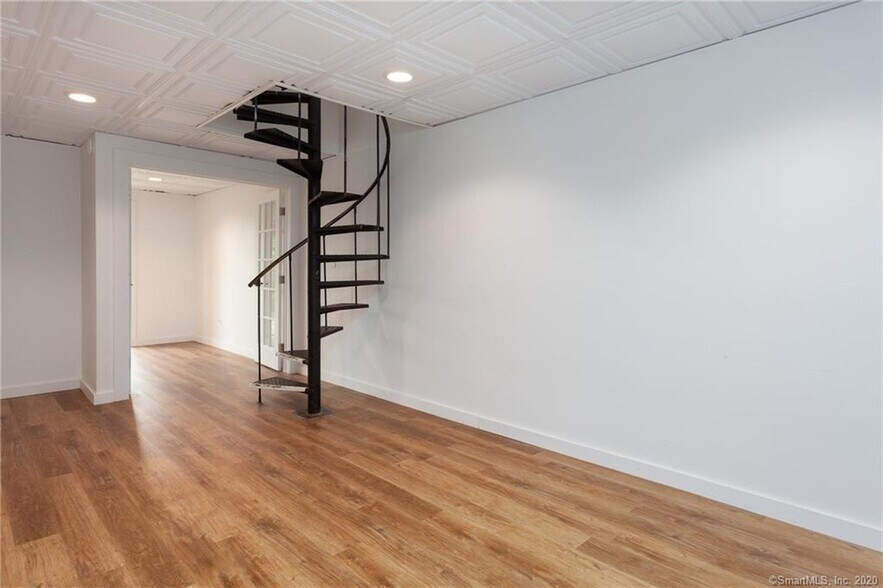 Spiral staircase to second living space - 188 Flax Hill Rd