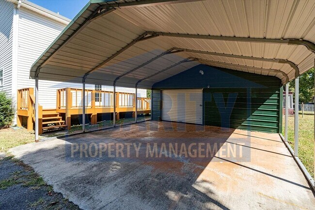 Building Photo - Updated house with carport and shed on corner lot!