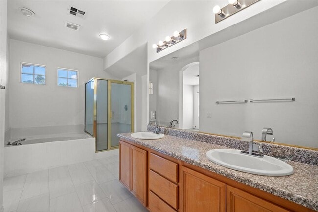 Building Photo - Contemporary Guard-Gated Retreat Near Rhodes Ranch Golf Club with Elegant Open-Concept Living