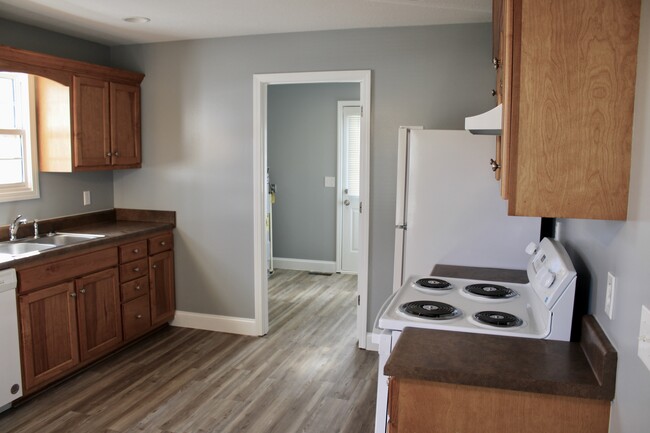 Kitchen leading to laundry room. - 310 Chestnut Alley