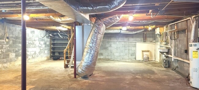 Building Photo - HALF OFF FIRST MONTH RENT! Single family brick home with full unfinished bsmt & detached garage