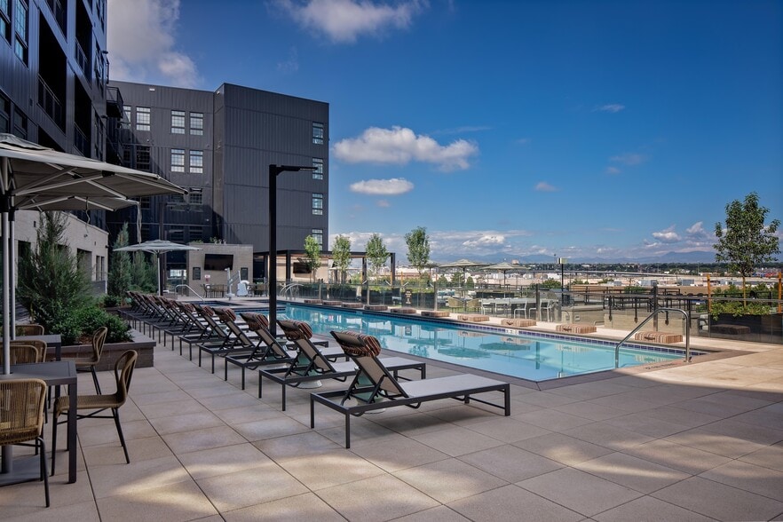 Lavish pool and spa deck featuring bar area and firepits - Modera Art Park