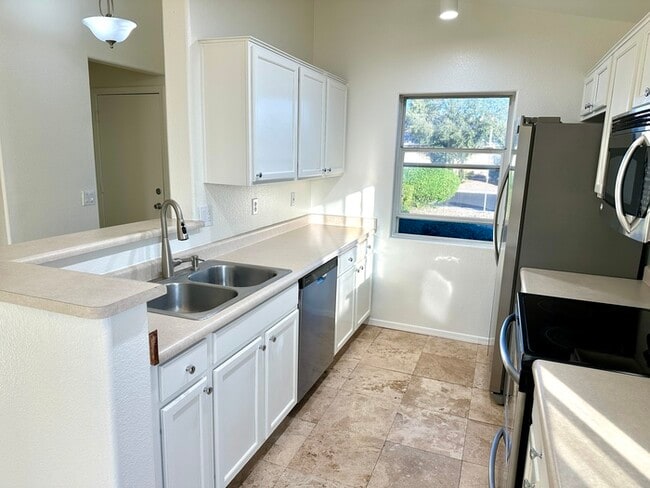 Building Photo - Adorable single story, corner lot home with 3 bedrooms, 2 bathroom and 2 car garage with a huge b...