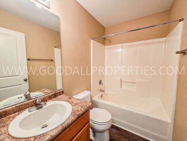 Building Photo - Bright & Spacious Waukee Townhome Near Dining, Shopping & Entertainment and attached 2-car garage