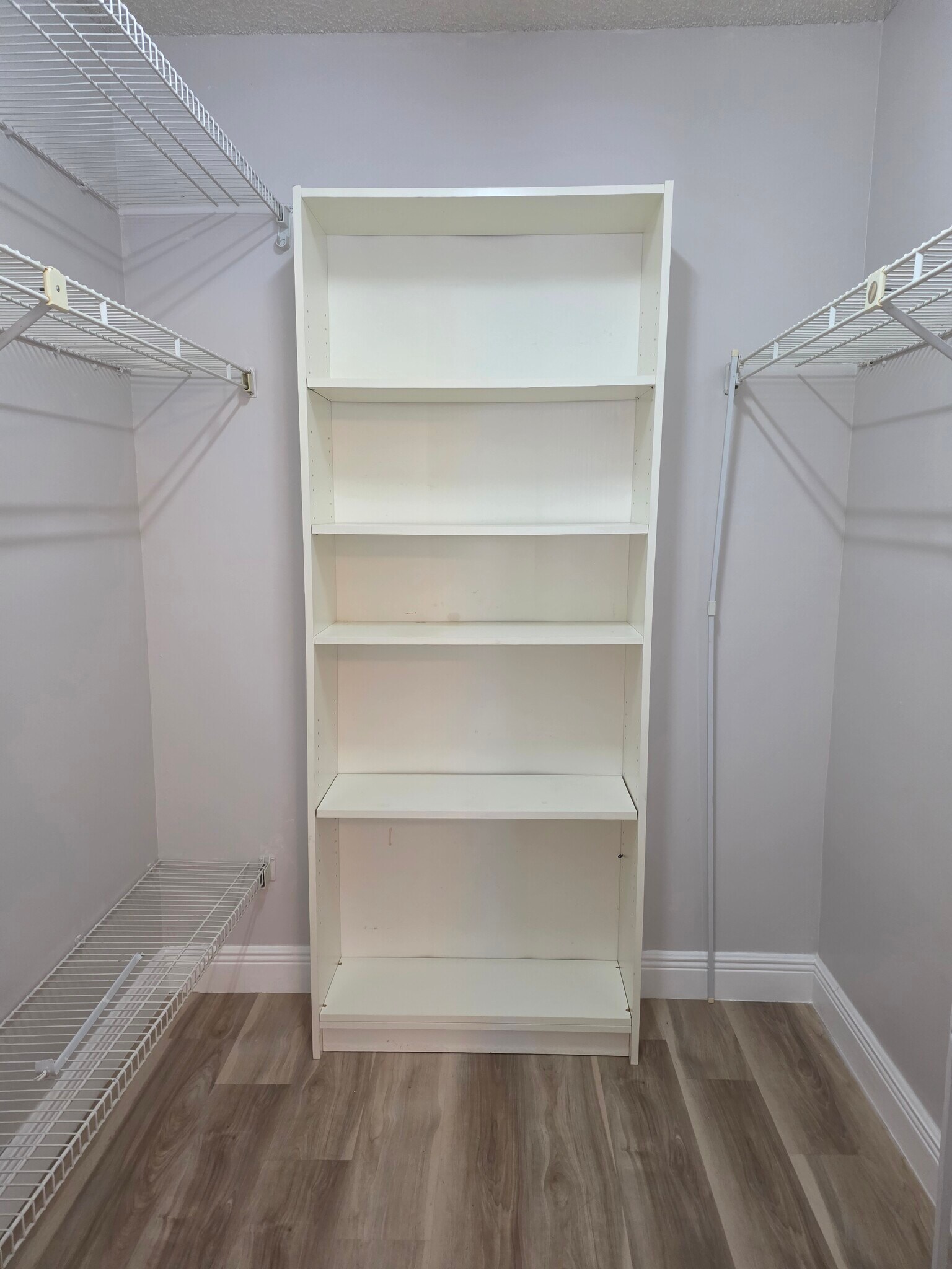 Master bedroom closet - 2222 N Cypress Bend Dr