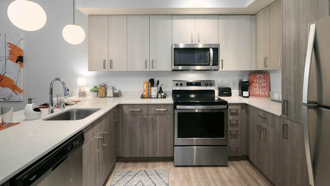 Kitchen with Stainless Steel Appliances and Quartz Countertops - Notch
