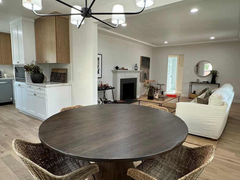 Dinning Room / Kitchen with brand new stainless steel appliances to the left and living room to the - 5950 Simpson Ave