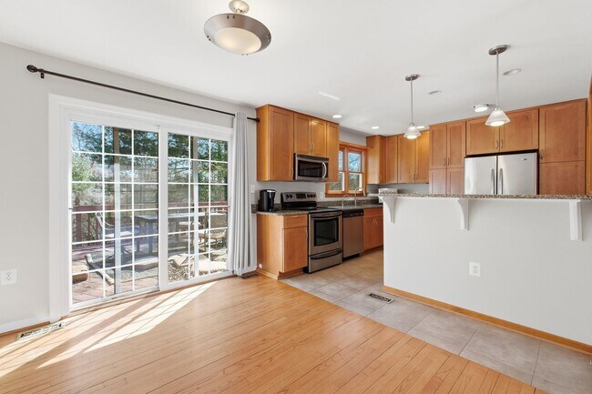 Building Photo - 5BR / 3BA Home with Flexible Living Space & Tree-Lined Views