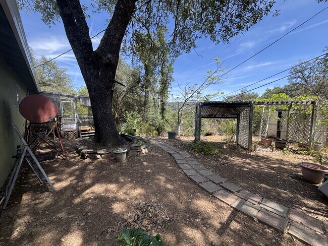 Building Photo - A gardener's delight! 3-bedroom home nestled in the countryside but close to town.