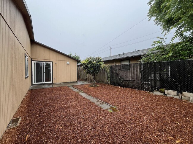 Building Photo - Inviting 2 Bedroom Home with Open Layout, Stainless Steel Appliances & Private Outdoor Retreat