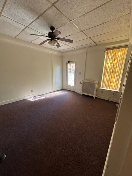 Livingroom showing front door & Ceiling Fan - 151 N Hanover St
