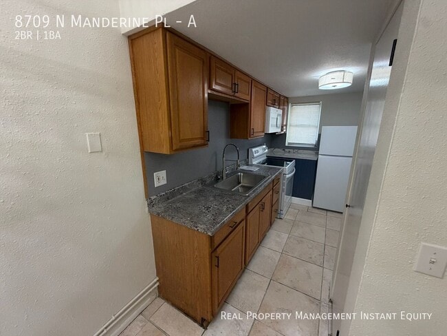 Building Photo - 8709 N Mandarine Pl