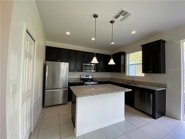 Building Photo - Beautiful End Unit Townhome Near Lake Nona w/ 2-Car Garage & Conservation Views!