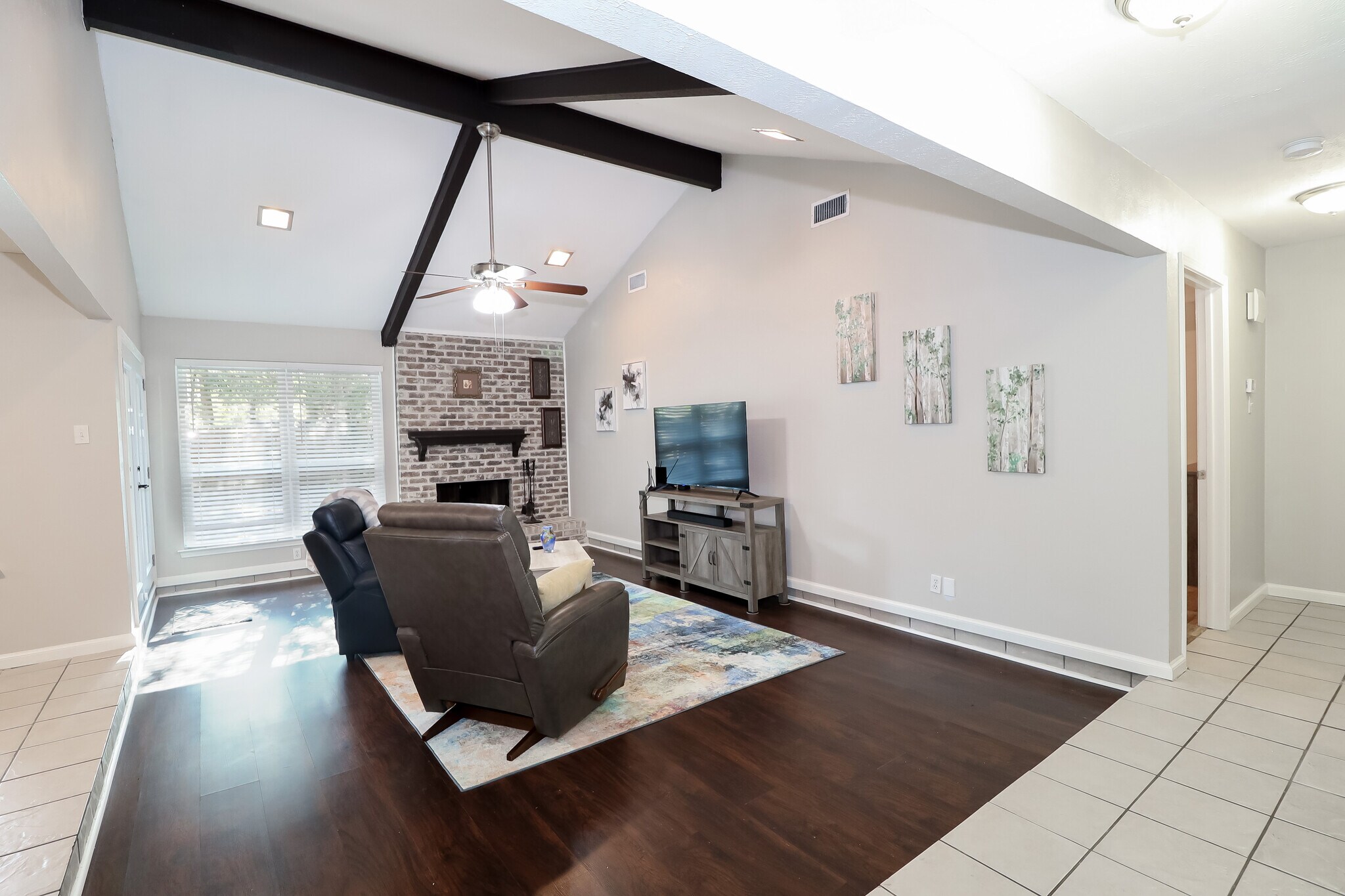 This view of the living room is from the entry hallway. Honey, I'm home! - 2507 Holt Road