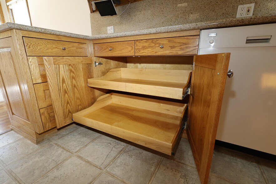 Plenty of thoughtful storage and beautiful oak cabinetry all around. - 4831 Canoga Ave