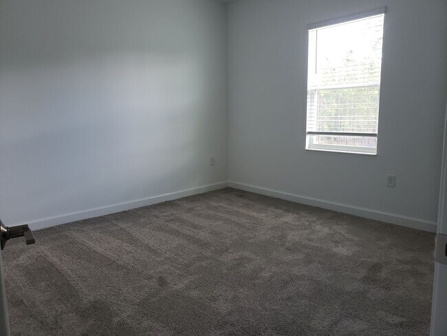 Building Photo - Bridgewalk Corner Lot Home with Wooded View and Solar Panels