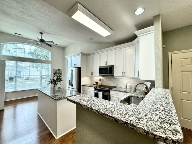 Building Photo - READY NOW!! End-Unit Loft-Style Condo w/1s...