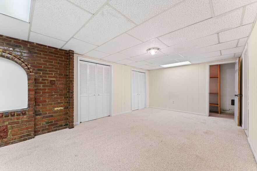 Closets line the 6th bedroom or den in Lower Level - 9 Snug Hill Ct