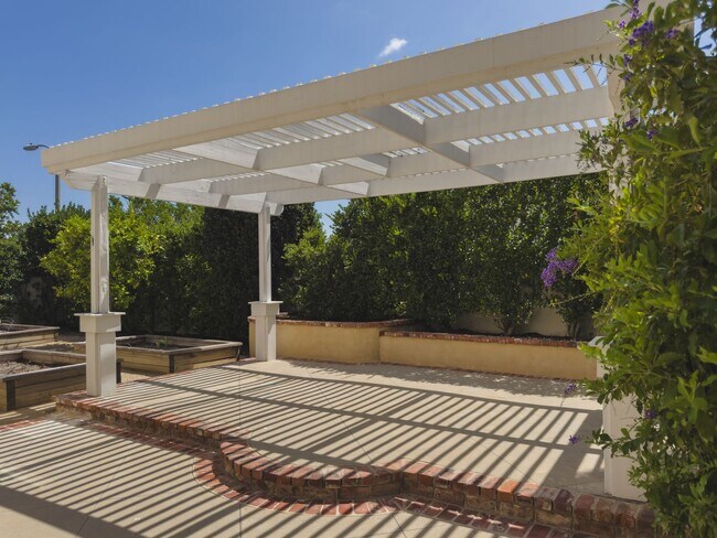 Building Photo - Elegant Mediterranean Living with Private Pergola Garden & Resort Amenities