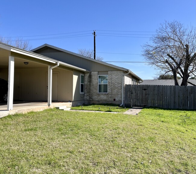 Front of Duplex - fenced yard with shady trees in summer - 12811 Broughton Way