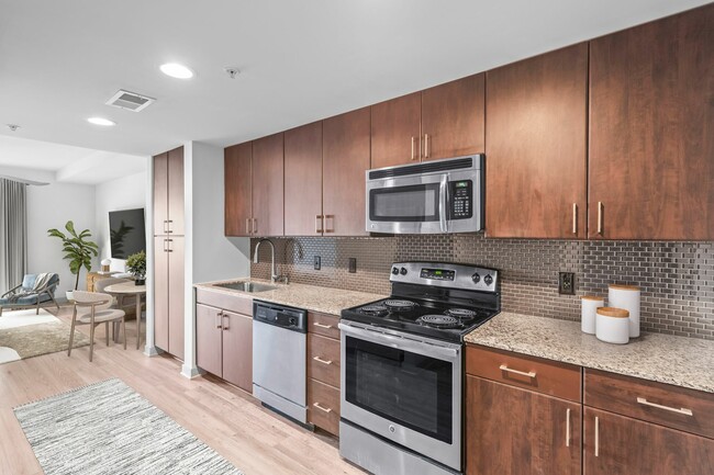 Experience the elegance of modern living with this stylish kitchen and dining setup at Cottonwood Westside Apartment in West Midtown Atlanta - Cottonwood Westside