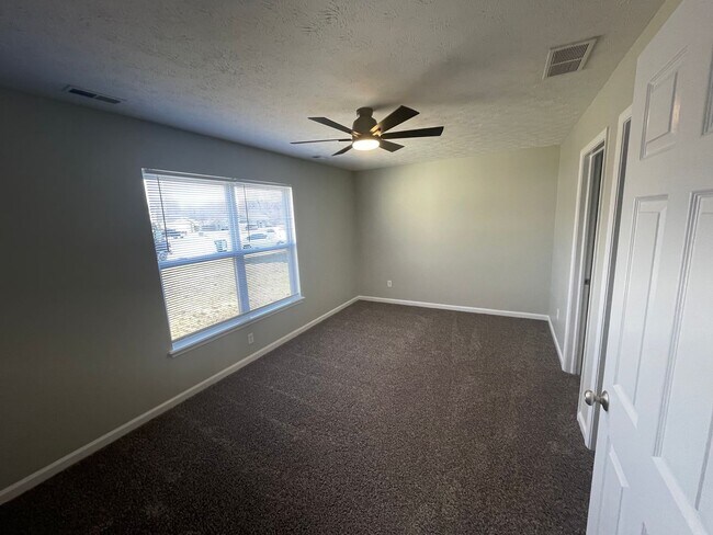 Building Photo - SUBLEASE - Three Bedroom Single Family Home with Fenced Backyard