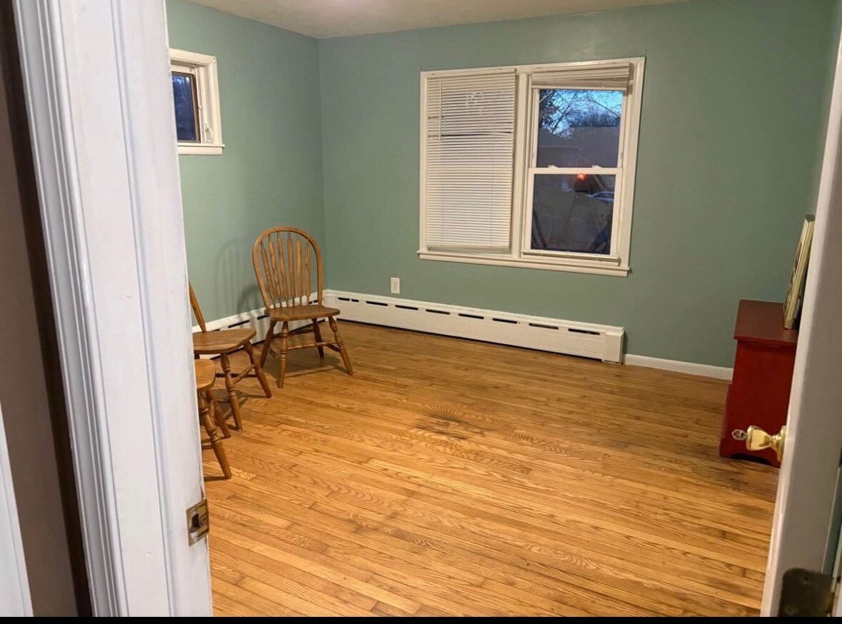 This room now has furniture and a queen bed. - 233 Roosevelt Ave