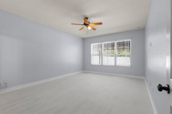 Building Photo - Spacious 6-Bedroom Home Near Lake Nona | 3-Car Garage + Tesla Charger