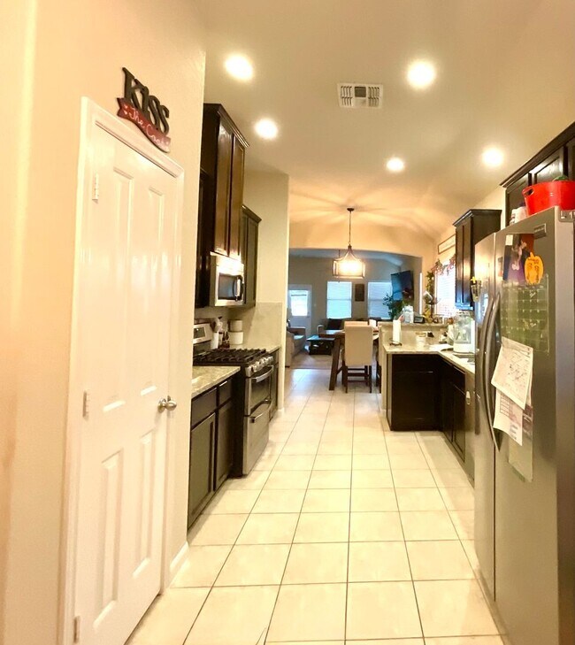 Building Photo - *COMING SOON* Modern Home with Fenced Backyard, Community Pool & Playground!